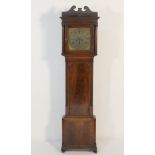 George III mahogany eight day longcase clock, the hood with fluted pilasters flanking a 13 ins brass
