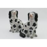 Pair of Victorian Staffordshire spaniels, circa 1870, finished in black and white glazes, height