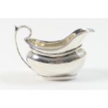 Victorian silver milk jug, by The Barnards, London 1876, helmet shaped and engraved with a band of