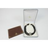 Amita black onyx beaded necklace, with matching diamond and onyx brooch, circa 2007, triple stranded