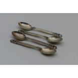 Four Georg Jensen Acorn pattern silver teaspoons, London import marks for 1930, weight approx. 60.4g