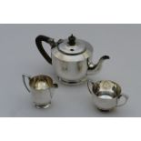 George VI silver three piece tea service, London 1943, in late Art Deco style, comprising teapot,