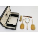 Modern silver cased vanity set, Birmingham 1956, comprising hand mirror, two hair brushes, clothes