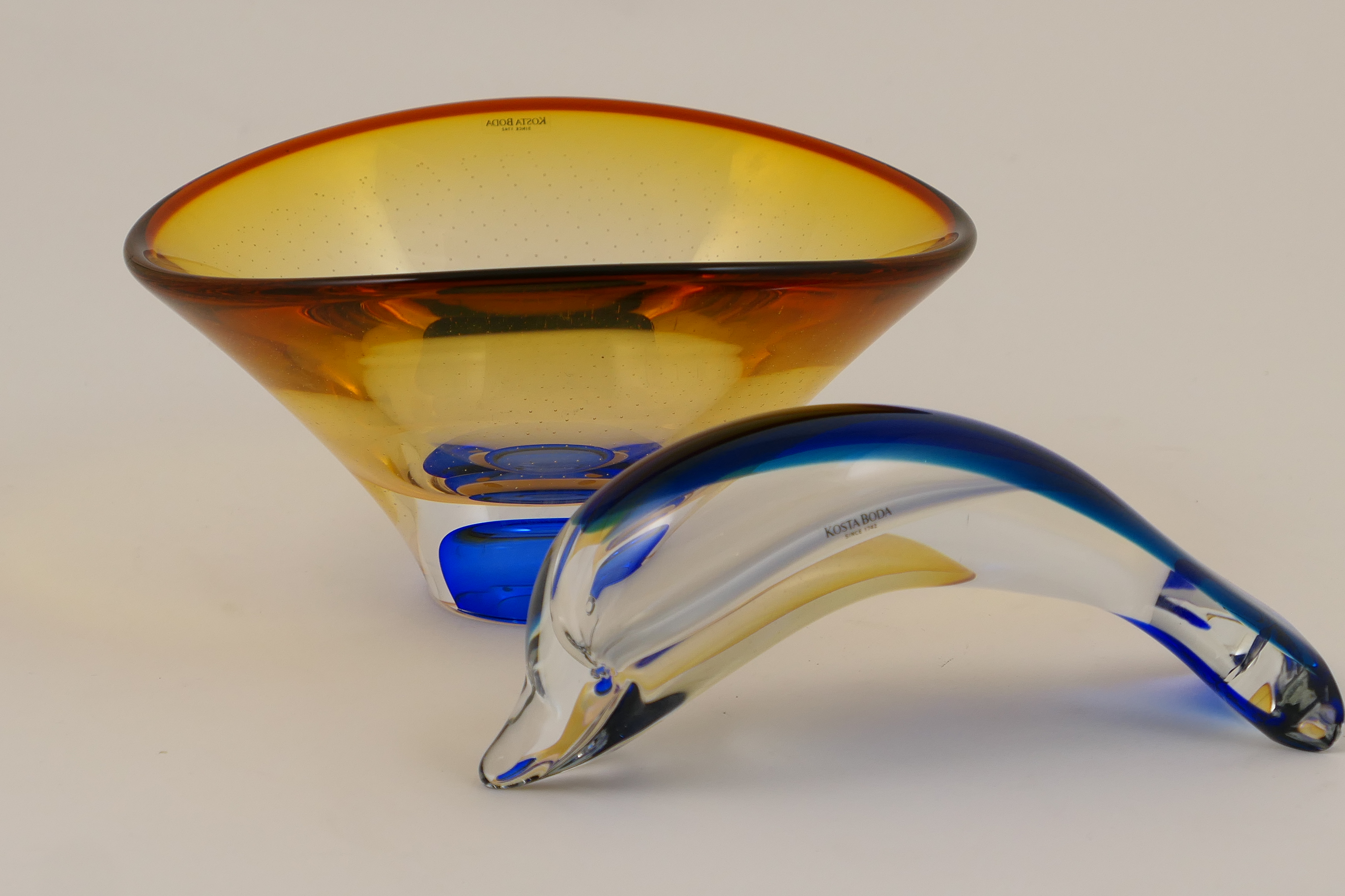 Kosta Boda studio bowl, by Goran Warff, flared form, tinted with orange and detailed with myriad