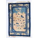 Chinese pictoral woollen rug, the field featuring horses in a mountainous landscape in fawns and