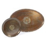 Hugh Wallis, Altrincham, hammered copper oval serving tray, centred with silvered foliate details,