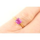Ruby solitaire ring, square cut stone of approx. 0.5ct, in a white gold four claw mount on a