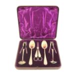 Victorian gilt electroplated fruit and nut set, circa 1885, comprising two fruit spoons, grape