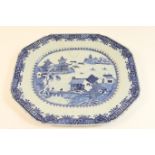 Chinese blue and white export meat plate, late 18th Century, decorated with a pagoda river landscape