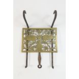 Late Georgian brass and wrought iron adjustable hearth trivet, rectangular brass plate worked with