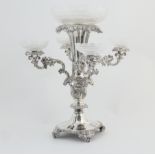 Victorian electroplated table centre, the central trumpet vase with acanthus collar supporting a cut