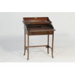 Late Victorian lady's mahogany writing table, the rectangular top with boxwood and ebony chequer