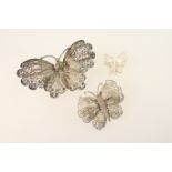 Three white metal filigree butterfly brooches, probably Italian, the largest 70mm, the smallest 23mm