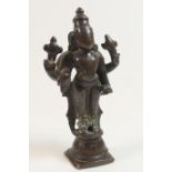 South Indian bronze figure of Vishnu, 18th Century or earlier, cast standing on a circular lotus
