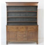 North Wales oak dresser, circa 1830, having a boarded plate rack over a base fitted with four