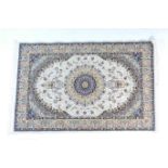 Iranian Isfahan style rug, cream field with a central fawn, blue and black medallion, within a