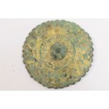 Gilt bronze disc brooch (pin missing), circular shield form with central boss, traces of gilt,