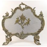 French cast brass firescreen, in Rococo Revival style, circa 1900, with winged cherubs (centred on a