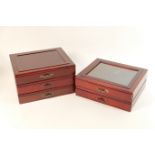 Five modern mahogany finish coin collector's trays, two being glazed and three enclosed, each fitted