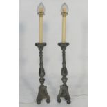 Pair of pewter altar sticks (converted), each now supporting a cut glass shade over an acanthus clad