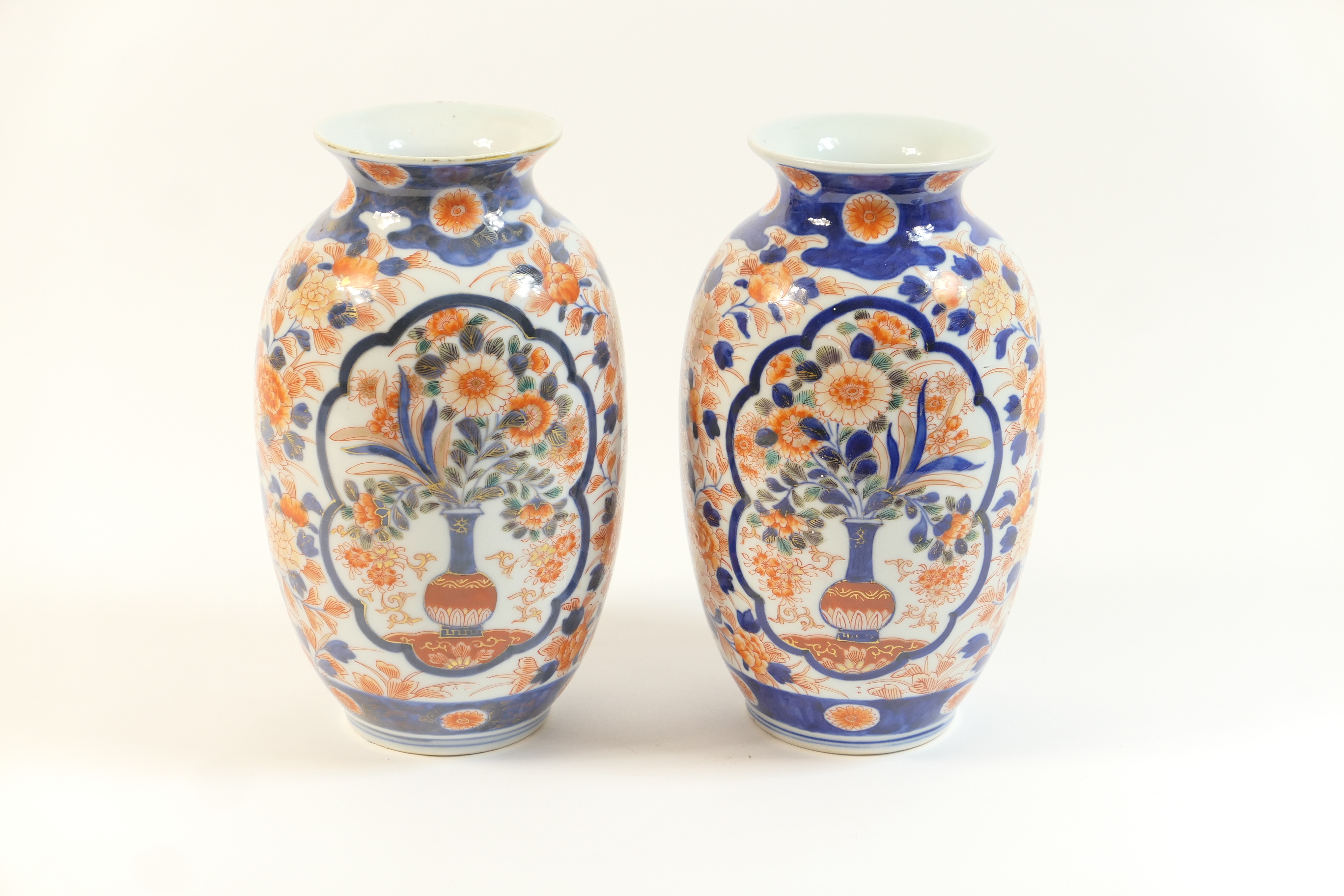 Pair of Japanese Imari vases, Meiji (1868-1912), decorated in typical palette with flowering vase