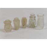Five Middle Eastern carved rock crystal bottles, the largest of reeded form, 55mm; two smaller of