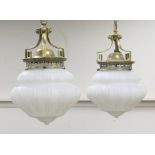 Pair of late Victorian brass and opaline glass hall lamps, supported from three keyed brackets, with