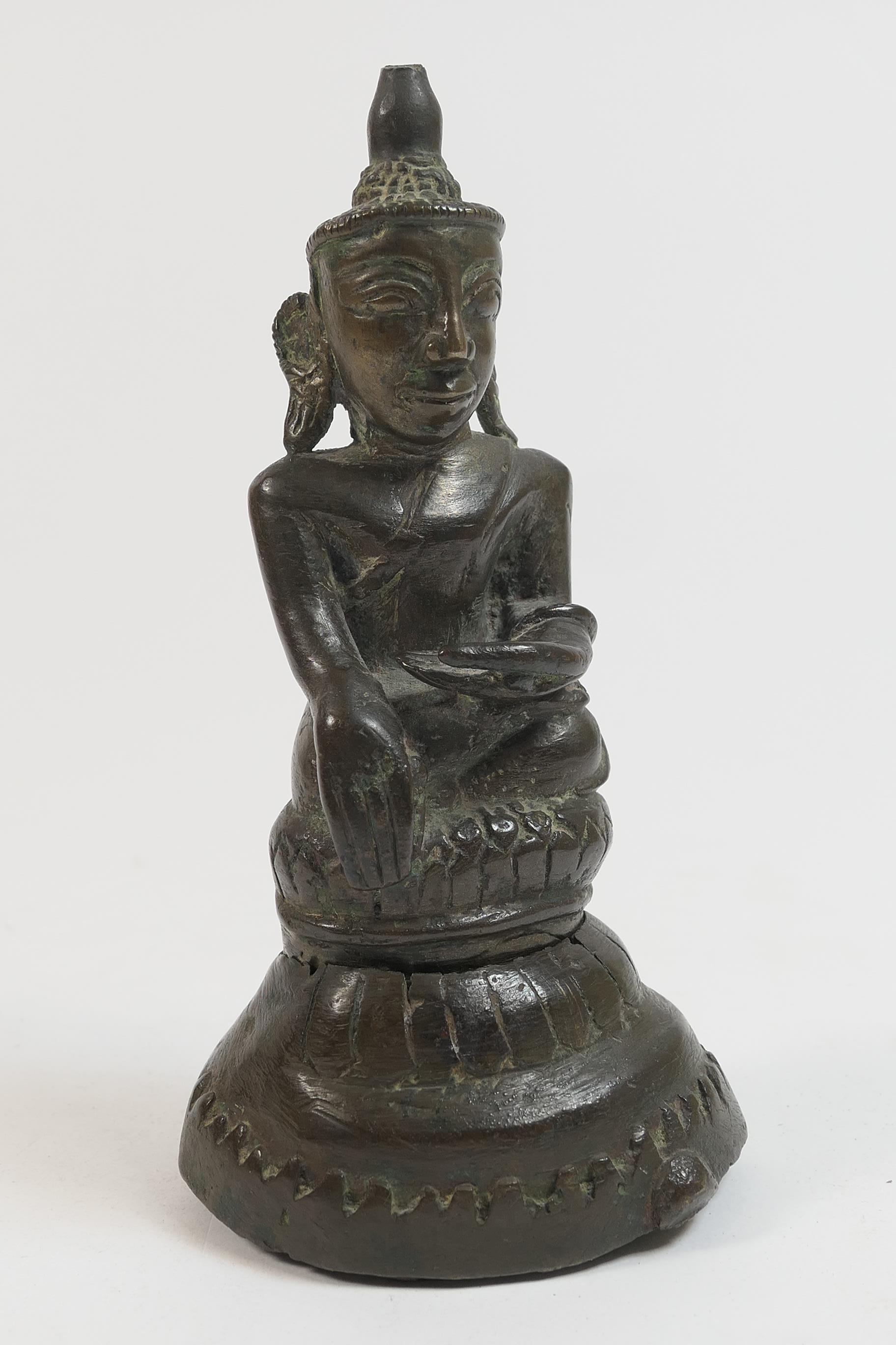 Antique bronze Buddha, possibly Cambodian (Khmer), 19th Century or earlier, seated in bhumisparsh