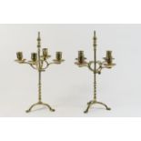 Pair of brass adjustable table candelabra, having four sconces with drip trays, adjusting with a