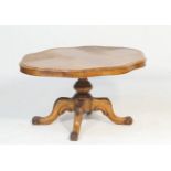 Victorian walnut breakfast table, shaped oval top with quarter veneers, tilting over a turned