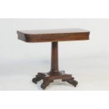 Early Victorian mahogany pedestal tea table, circa 1840, the swivel folding top over an octagonal