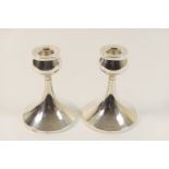 Pair of George VI silver dwarf candlesticks, maker WA, Birmingham 1949, in a modernist style, with a