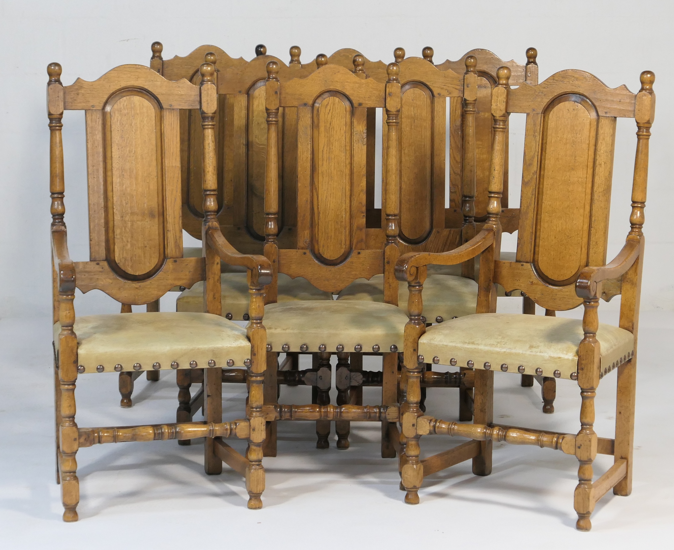 Set of eight oak dining chairs in William and Mary style, comprising two carvers and six singles,