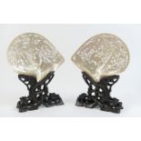 Pair of Eastern mother of pearl carved shell table screens, each worked with a scrolling dragon