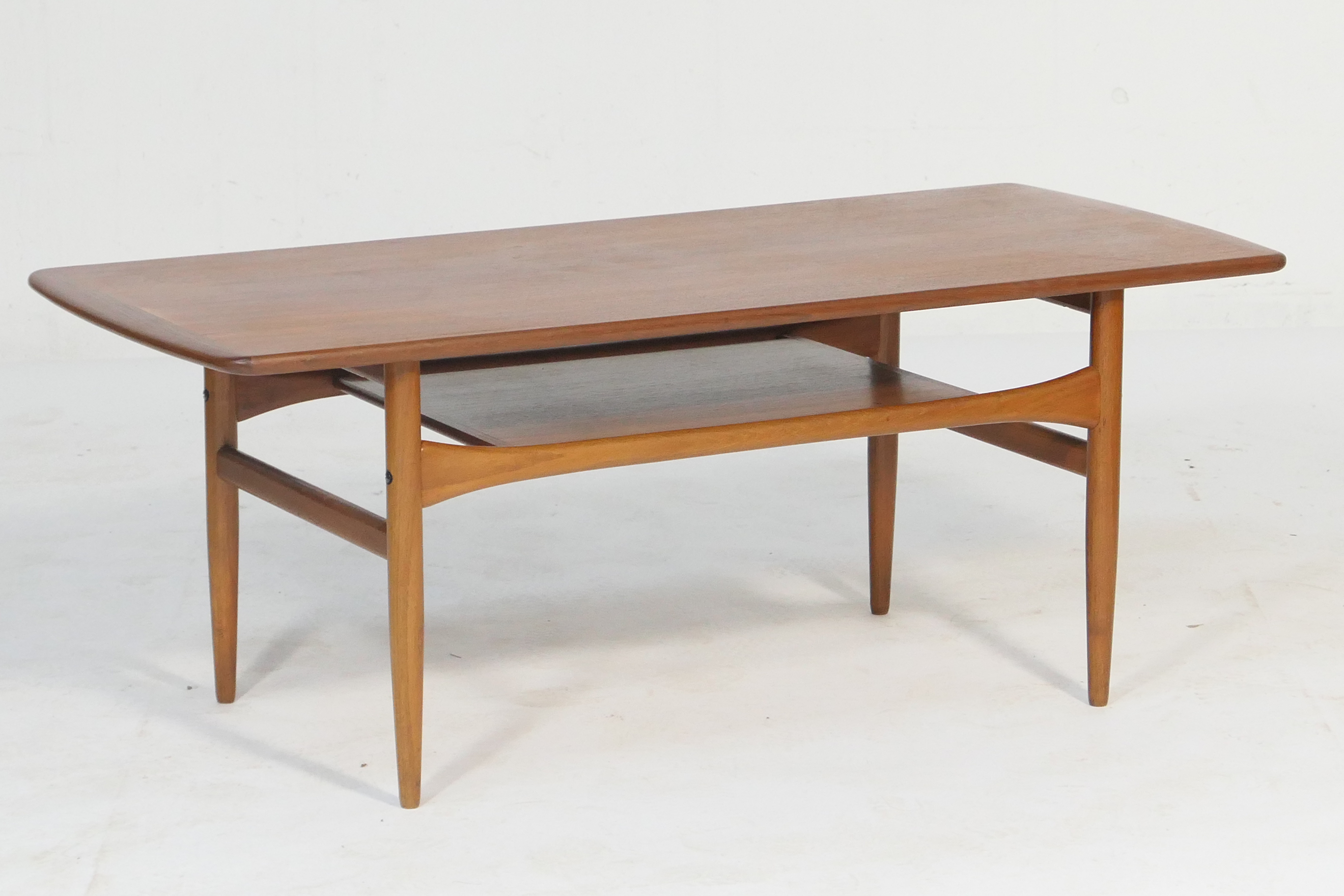 Retro teak coffee table, possibly G-plan, rectangular top with rounded ends, over an undershelf,