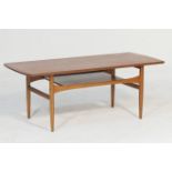 Retro teak coffee table, possibly G-plan, rectangular top with rounded ends, over an undershelf,