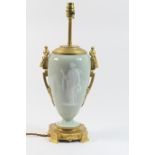 French ormolu mounted Limoges pate-sur-pate table lamp, the celadon body worked in white slip with a
