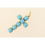 Turquoise cross form pendant, set with seven split turquoise stones in a gold foil backing, 3cm x