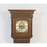 Oak eight day longcase clock, having a carved case, the hood initialled and dated 1898, brass 11 1/