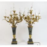 Pair of black marble and gilt metal table lamps, formed as a vase of lilies, the flowers