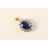 Sapphire and diamond pendant, matching the previous lot, the central oval sapphire measuring approx.
