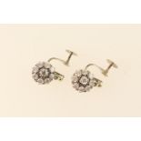 Pair of diamond cluster pendant earrings, each set with eight brilliants surrounding a slightly