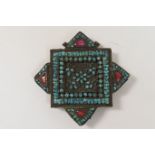 Tibetan Gav amulet box, star shape, copper inlaid with turquoise and inset with glass 'gems', 83mm