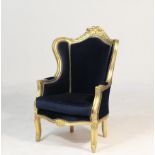 Italian style gilded and dark blue fabric upholstered wing armchair, width 78cm, depth 80cm,