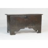 Oak boarded coffer, circa 1670, single plank top with moulded edge over an interior with candle box,