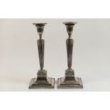 Pair of old Sheffield plated candlesticks, circa 1800, having a fluted urn shaped sconce with