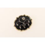 Victorian mourning brooch, shaped oval form inset with seed pearl flowers against a black
