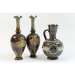 Pair of Royal Doulton stoneware bottle vases, circa 1900, each of ovoid form with a slender