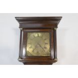 Thirty hour oak longcase clock, the hood with brass capped reeded columns flanking a 12'' brass