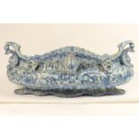 Impressive and large Savona blue and white maiolica table centre, 19th Century, boat shape with mask